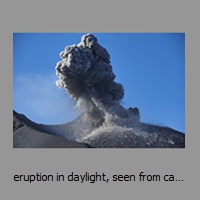 eruption in daylight, seen from camp